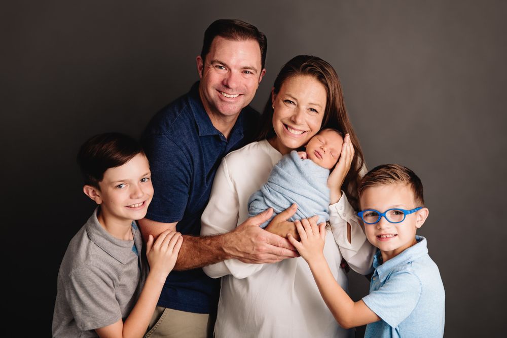 family posed for newborn photography session in kansas city