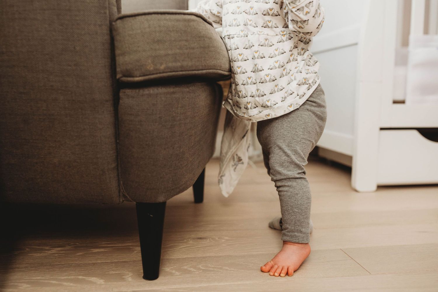 small baby feet girl standing