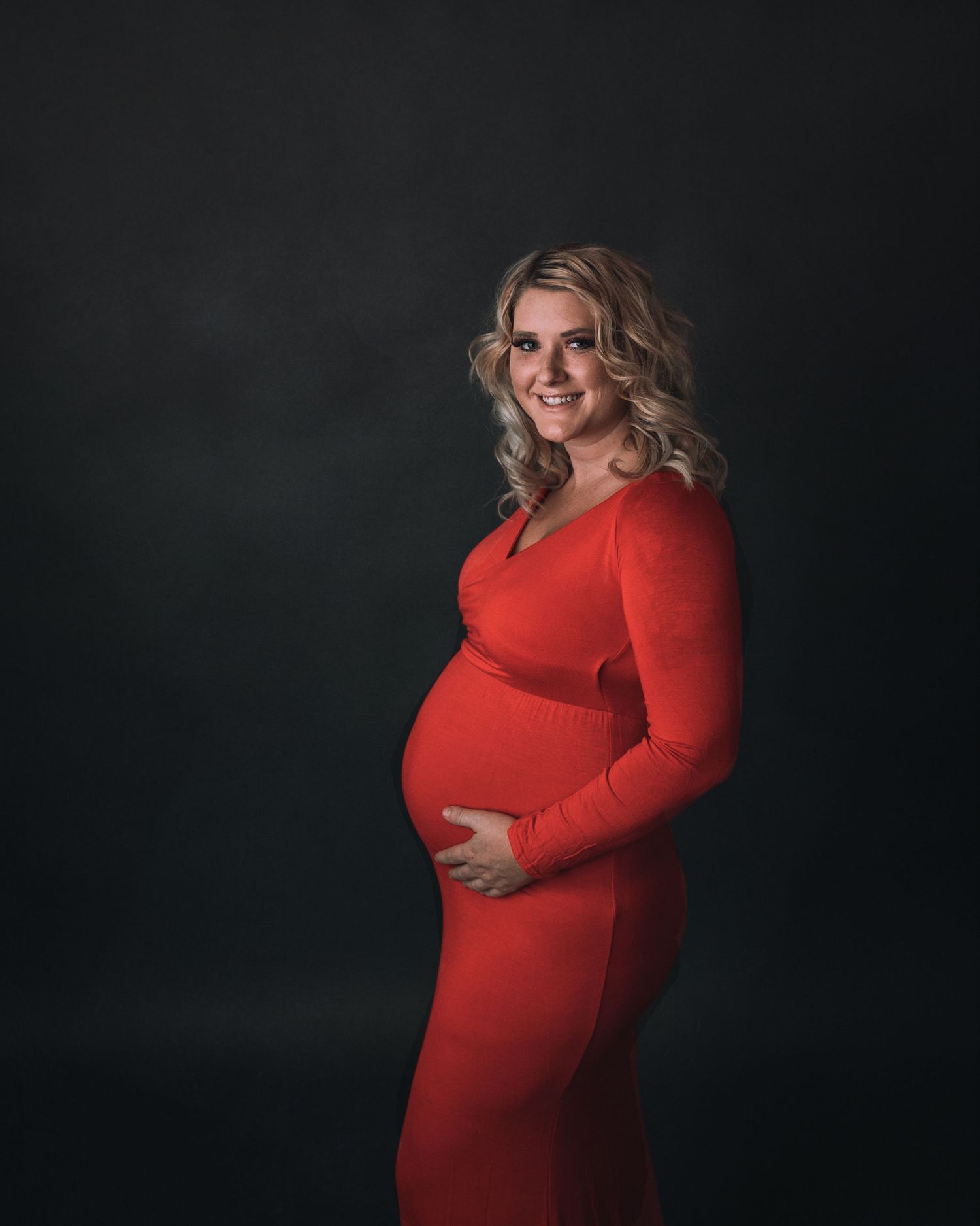 studio maternity pictures orange dress, long sleeve full length