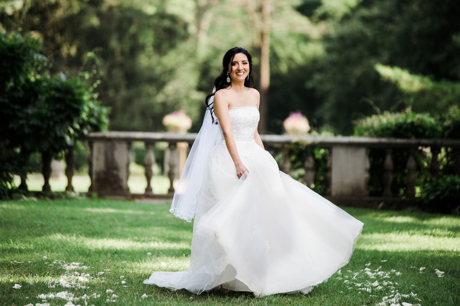 Bride swishes her tulle full ballgown style wedding dress