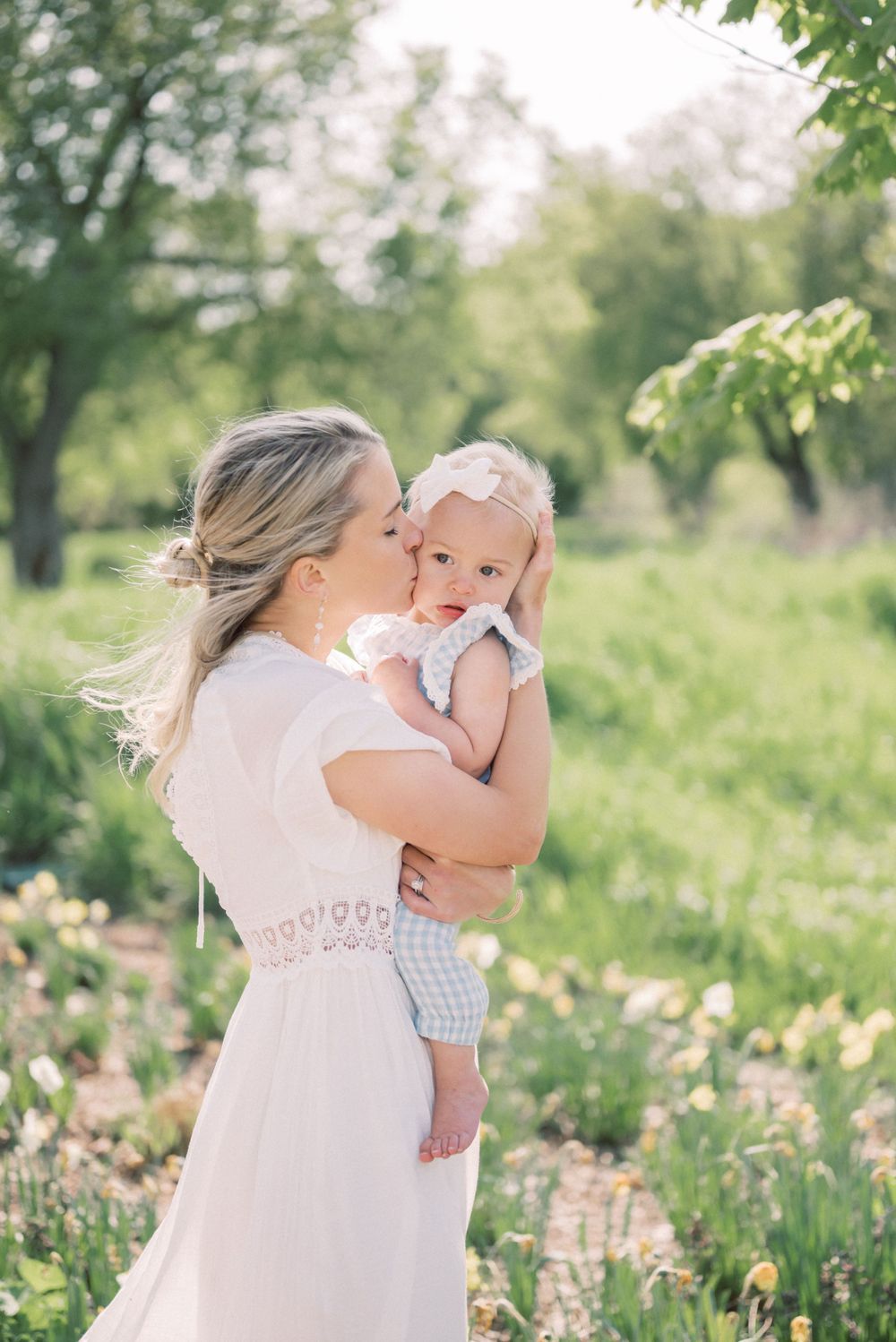 An intimate outdoor portrait with delicate lace details and sunlit backdrop.
