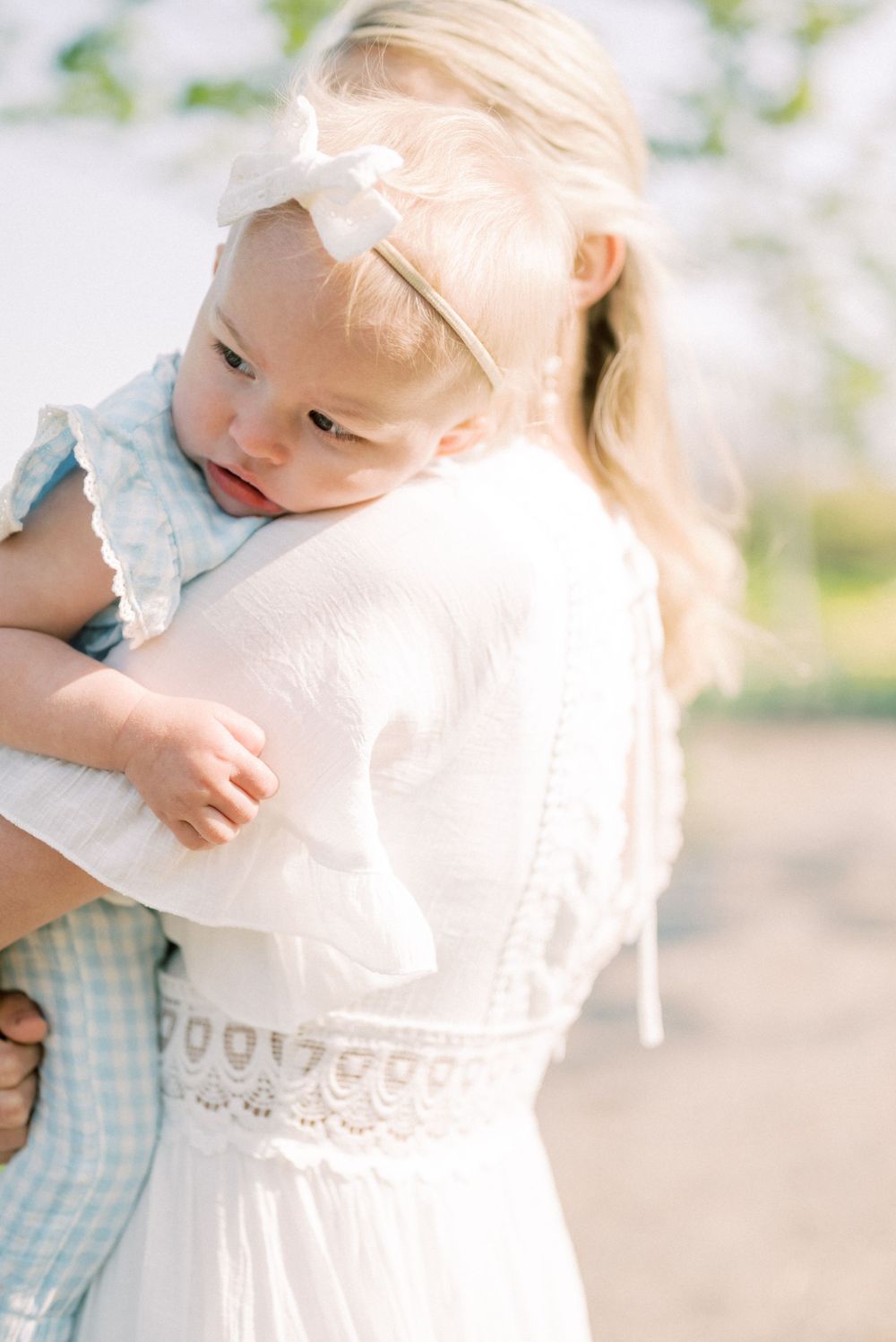 A lovely outdoor moment captured against a rustic barn backdrop.