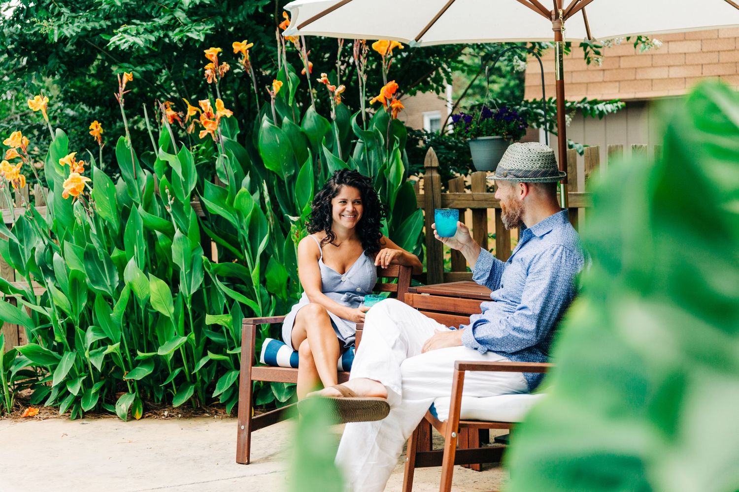 Parents enjoying a drink by the pool for family photos