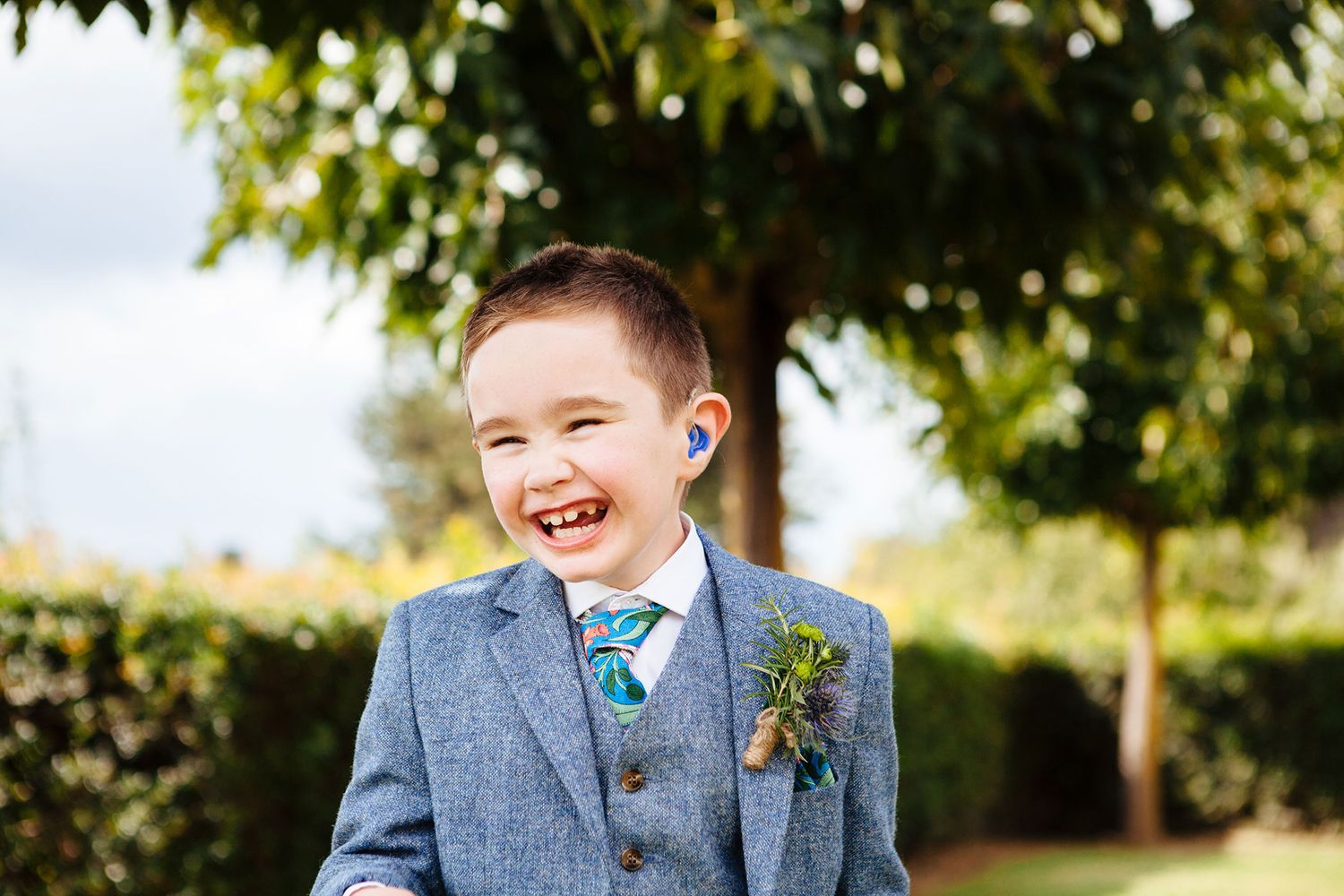 pageboy smiling at destination wedding in Tuscany