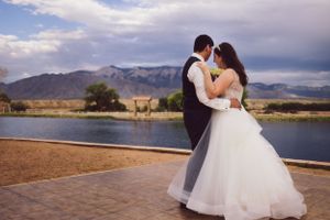 First dance in front of lake and mountains