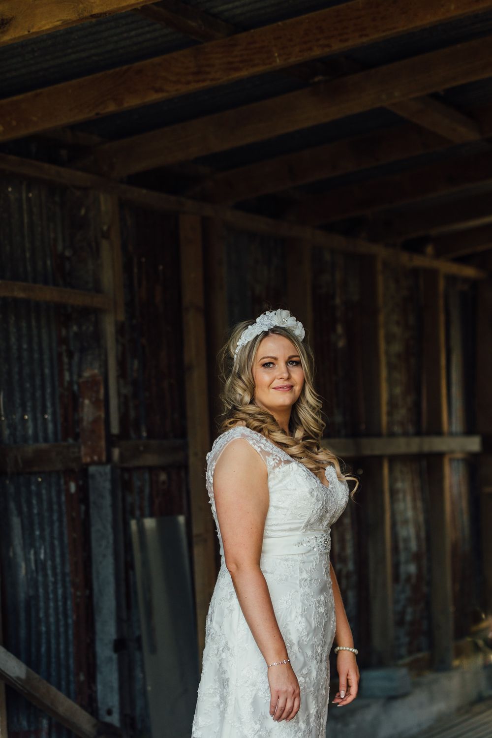 Bride looking over shoulder with flower crown