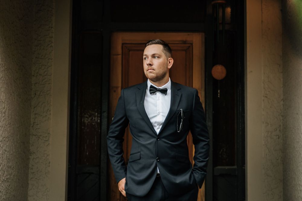 Groom standing in doorway