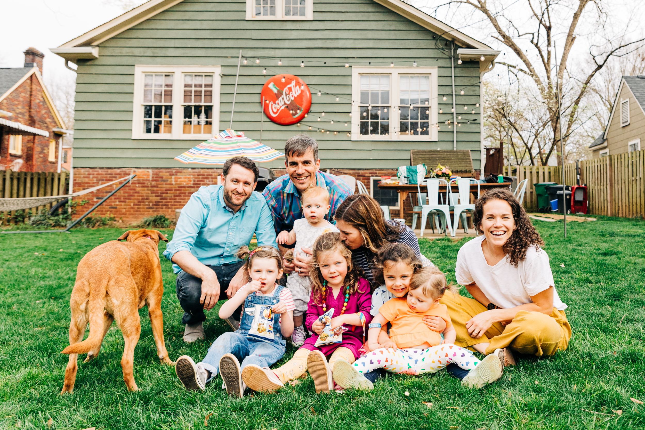 Two Charlotte, NC families smiling and having fun in their backyards together