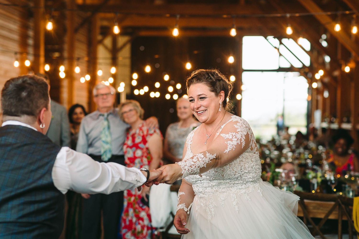 Lesbian brides dancing at their wedding reception.