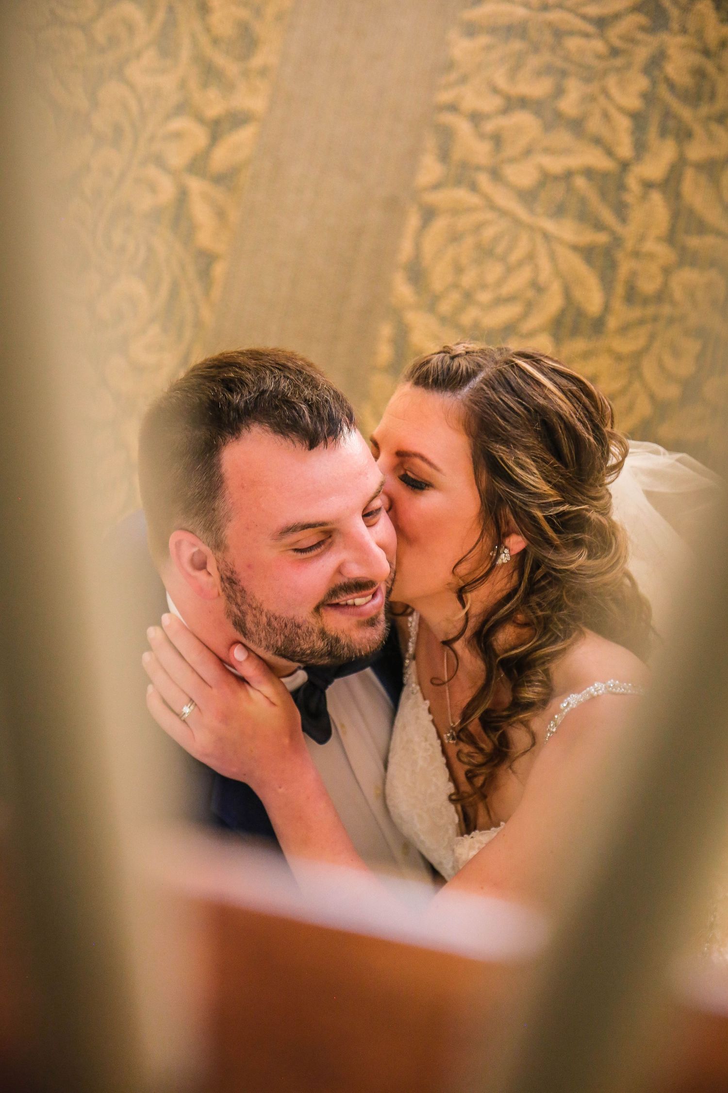bride and groom kiss at reception