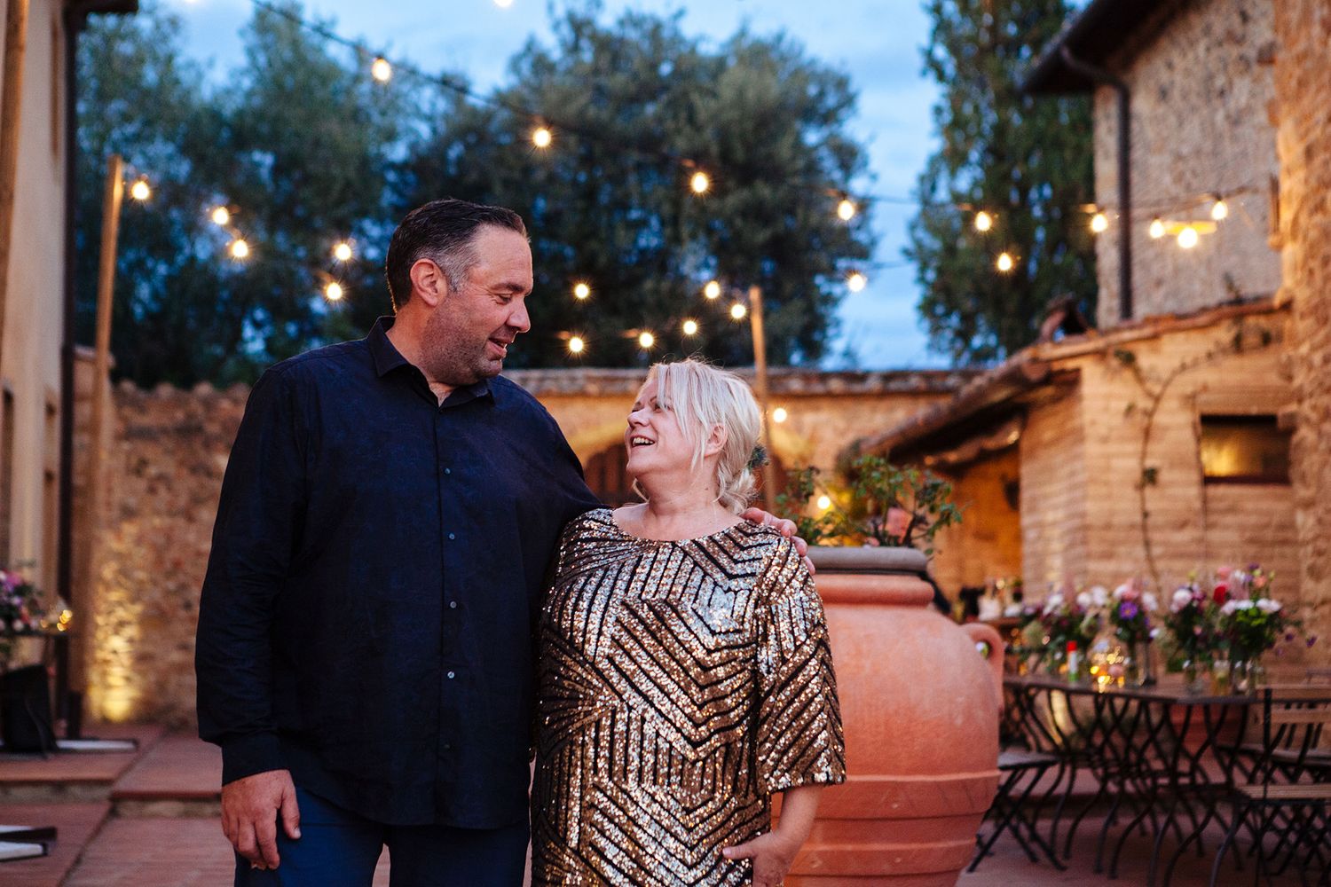 a change of attire for the bride and groom in the evening at this relaxed destination wedding in Italy