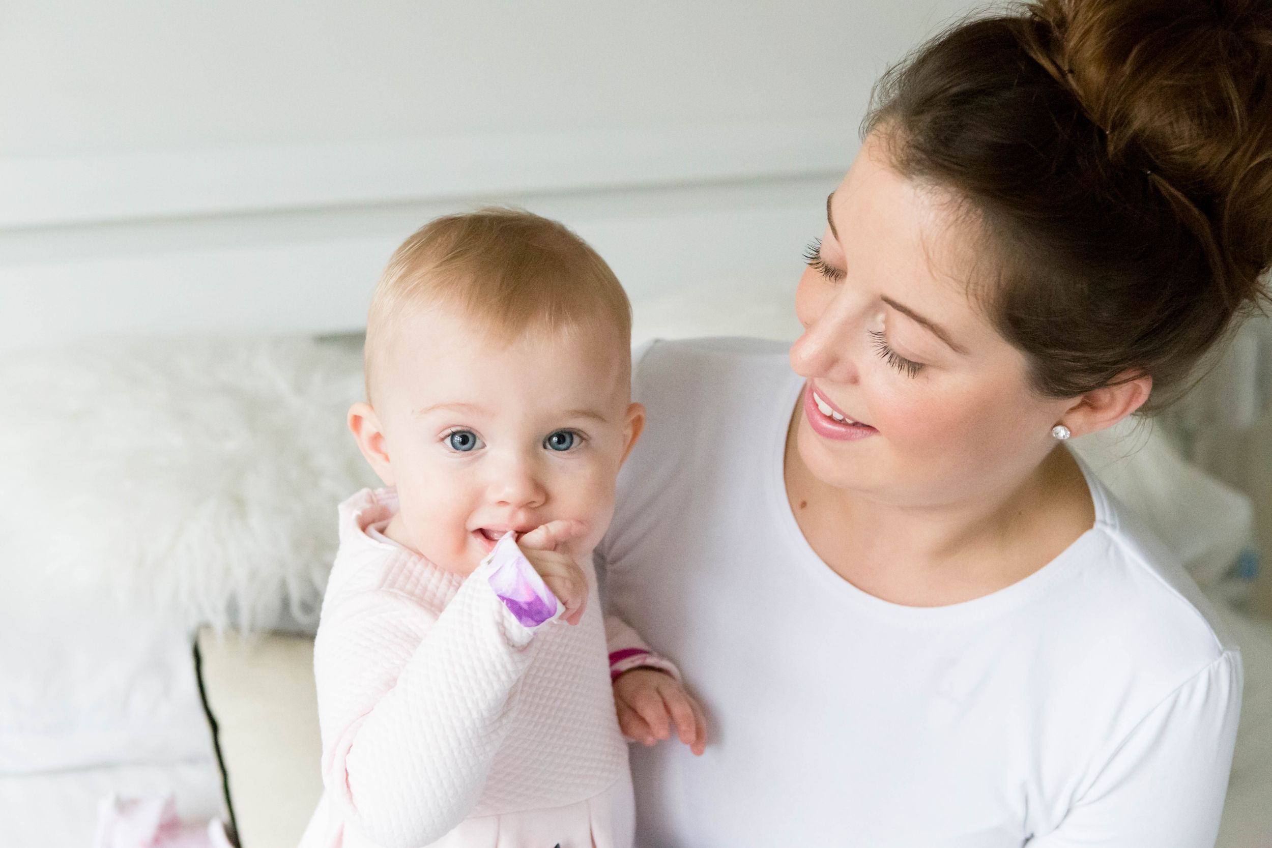 1 year old baby girl with mum at home