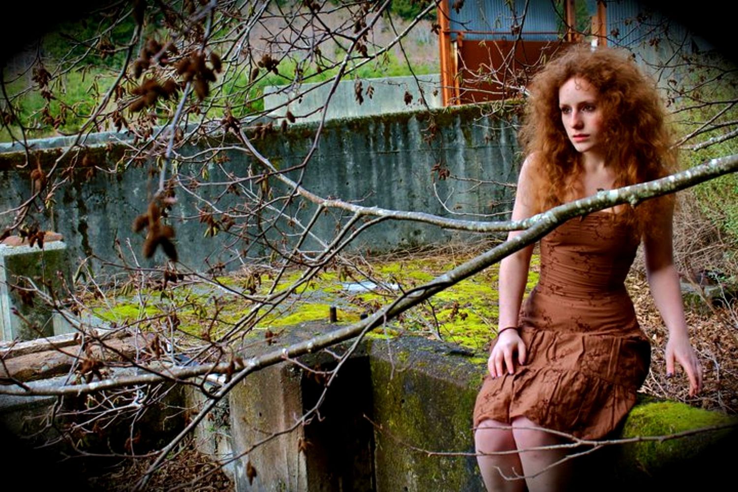 Some of Elise Odom's early photography work depicting a self portrait of Elise in nature sitting upon a cement wall