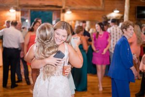 bride hugging guest