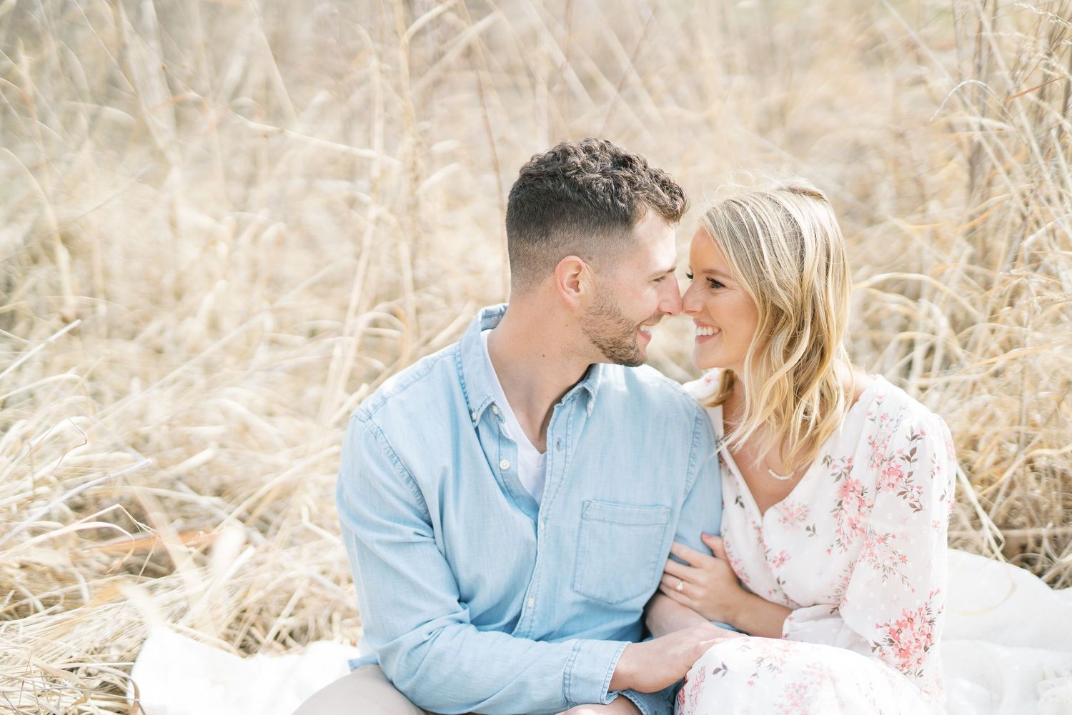 Light and airy film lakeside dock engagement session at Gray's Lake in Des Moines, Iowa