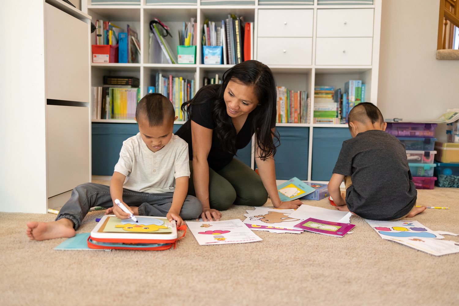2 kids and mom on floor doing coloring for school Homeschooling entrepreneur mom Maple Valley, WA branding photo