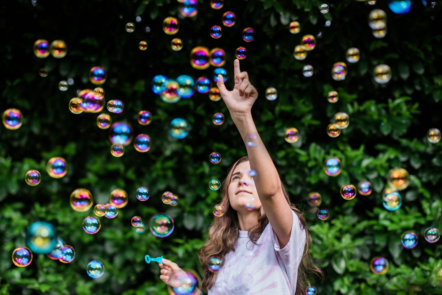 Teen Reaching for Bubbles | Photo by Lenka Vodicka of Lenkaland Photography with Anika Vodicka