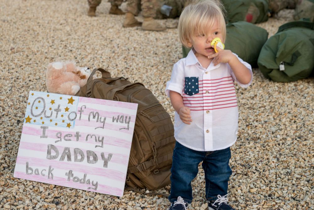 Little boy at his daddy's homecoming on Fort Carson
