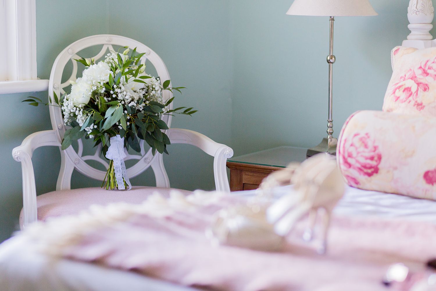 White wedding flowers in hotel suite