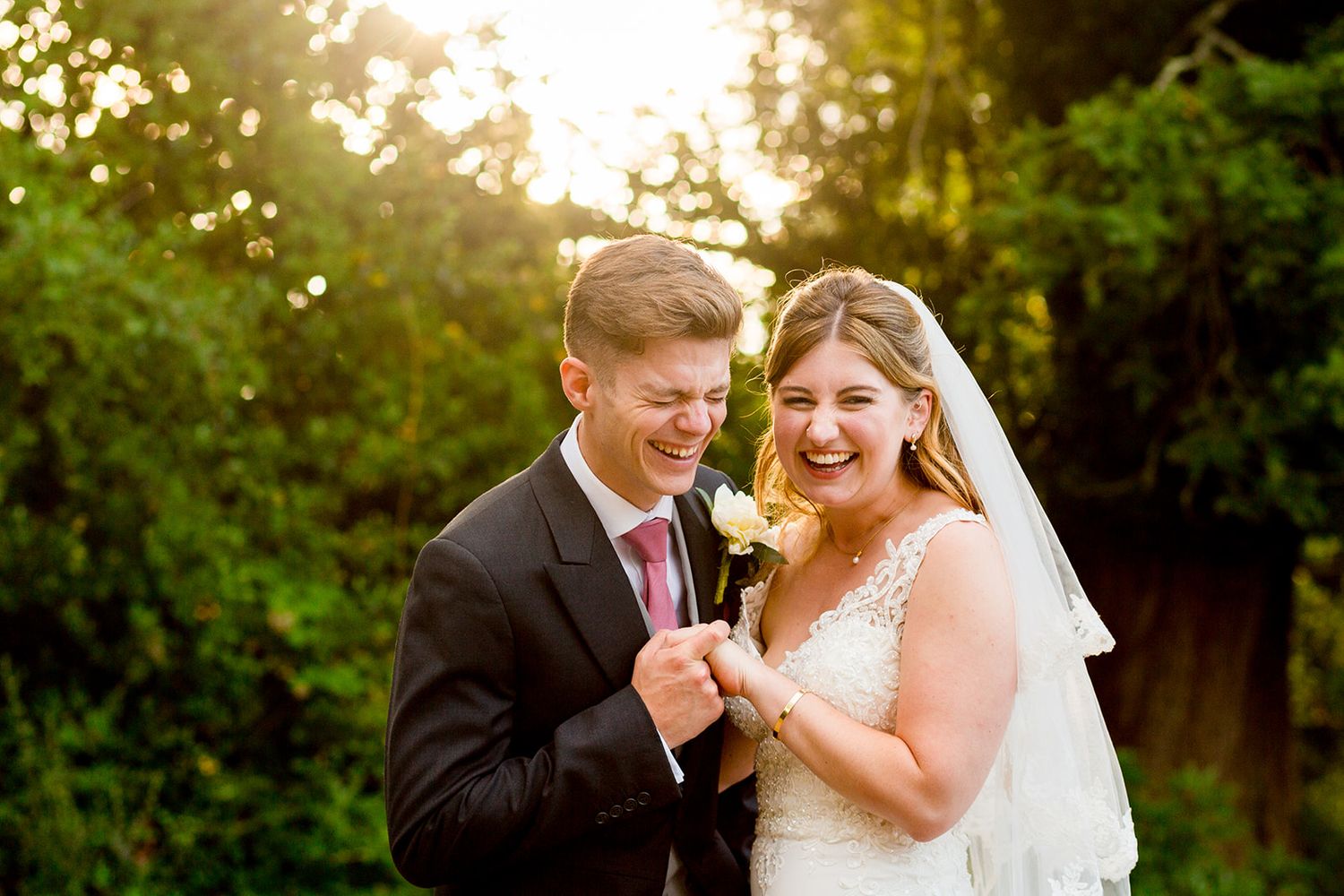 candid wedding photography laughing couple bride and groom