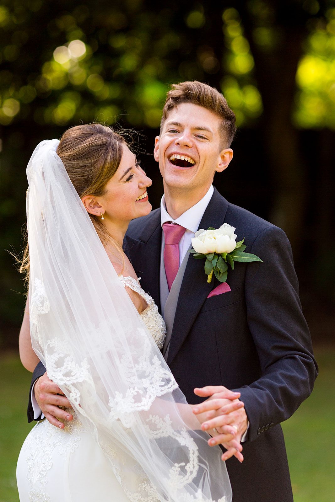 laughing wedding couple, moorhill house garden