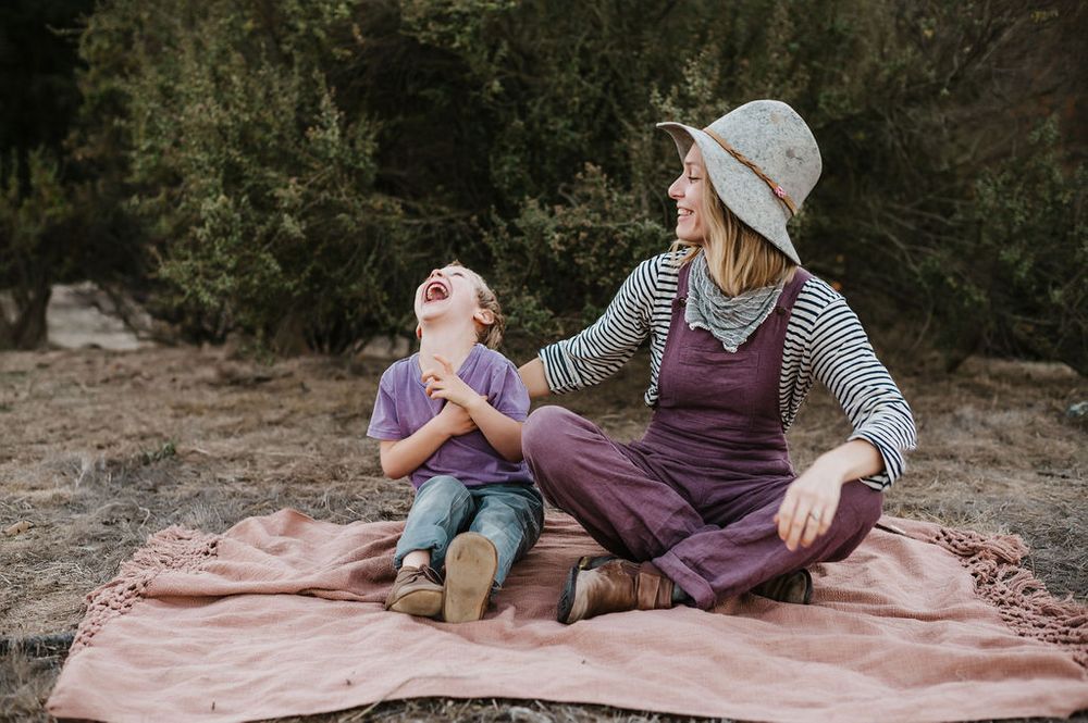 Playful motherhood and son family photography session outdoors on Sonoma County ranch.