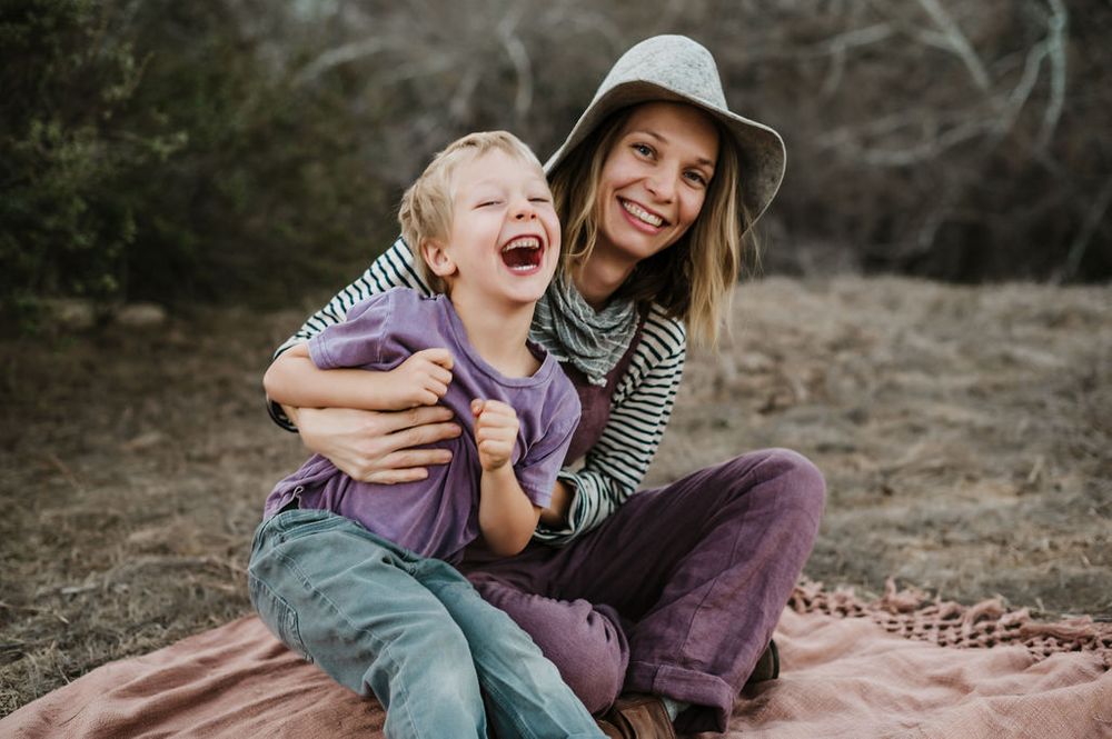 Playful motherhood and son family photography session outdoors on Sonoma County ranch.
