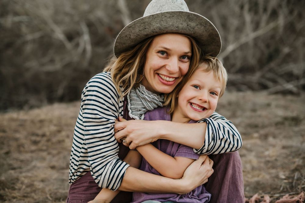 Playful motherhood and son family photography session outdoors on Sonoma County ranch.