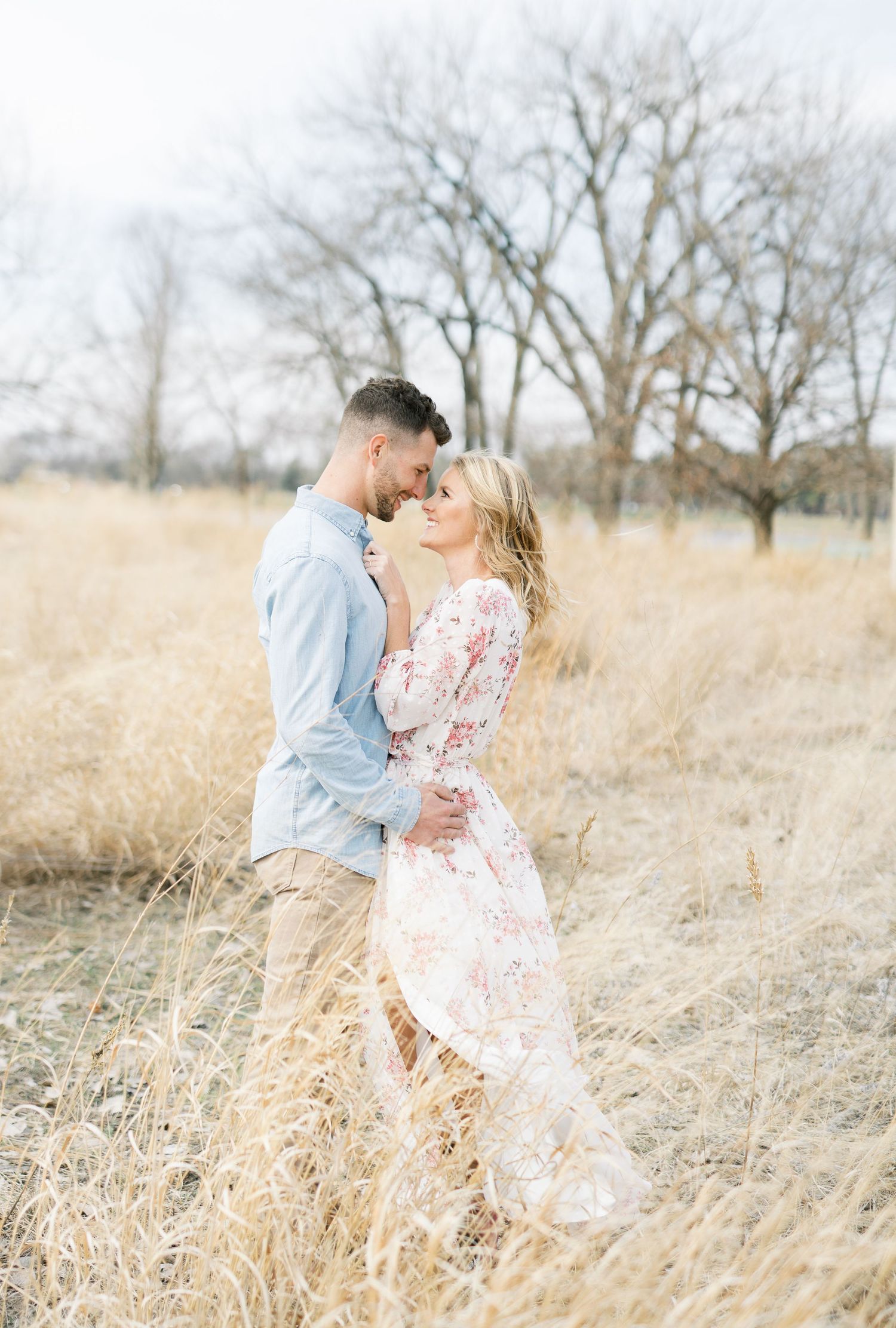 Light and airy film lakeside dock engagement session at Gray's Lake in Des Moines, Iowa