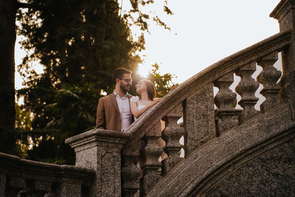 Decorative stone steps and balustrade create elegant architectural detail in afternoon sunlight.