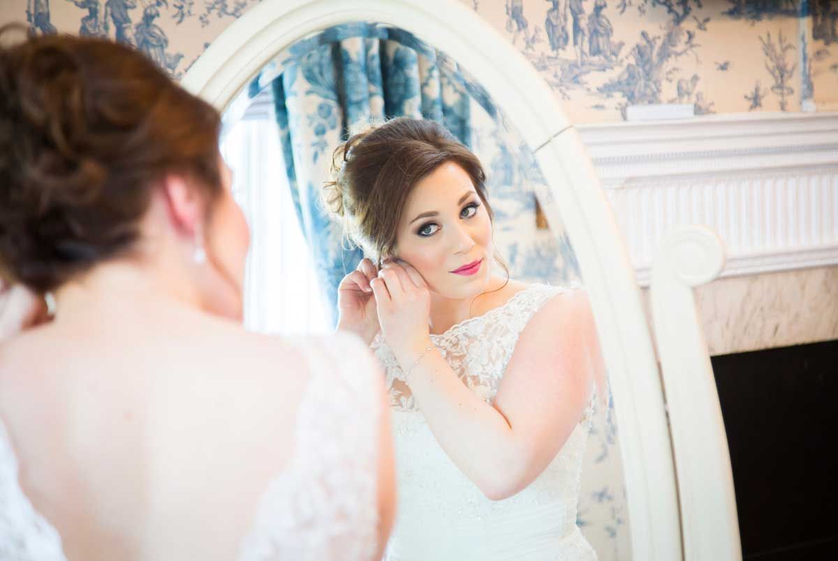 Brides reflection in mirror getting ready