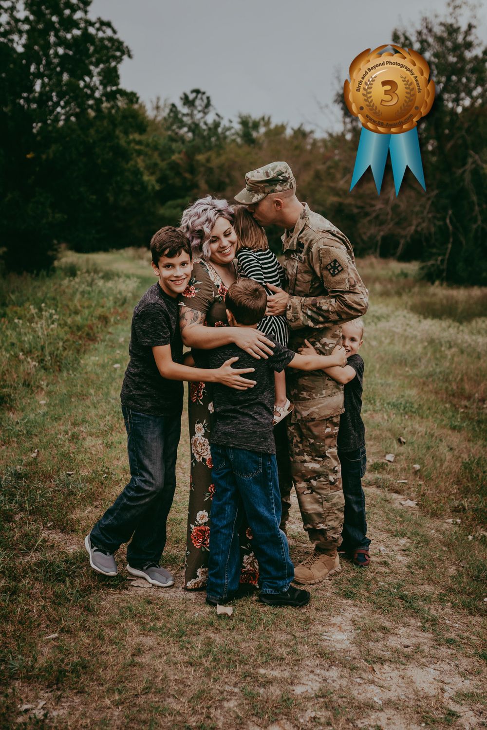 A family huddled together embracing each other happily. The father is wearing a military uniform. Award-winning image.