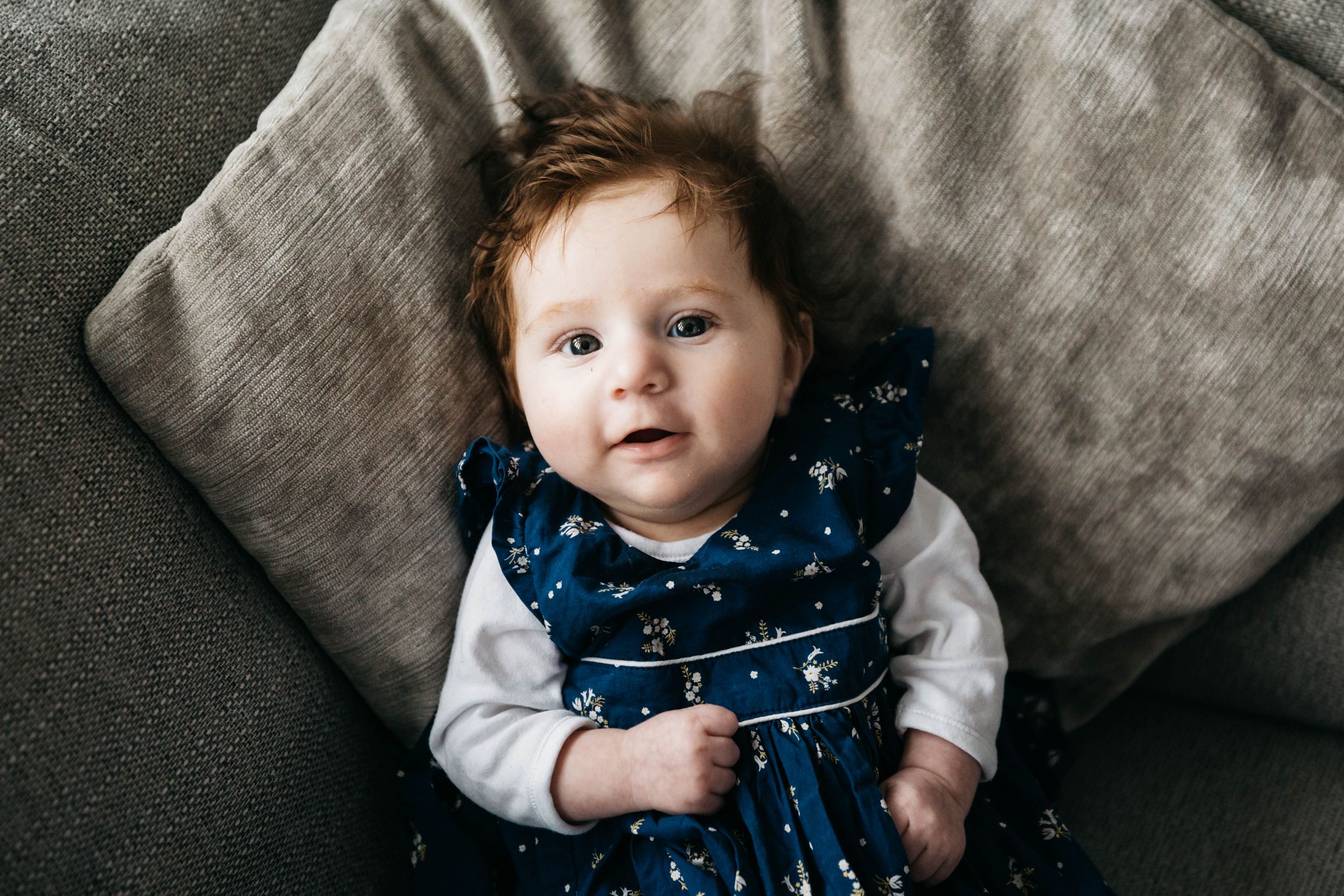 three month old baby girl in navy dress