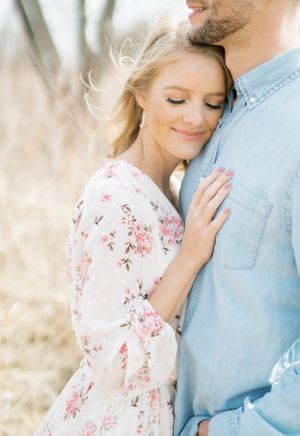 Light and airy film lakeside dock engagement session at Gray's Lake in Des Moines, Iowa