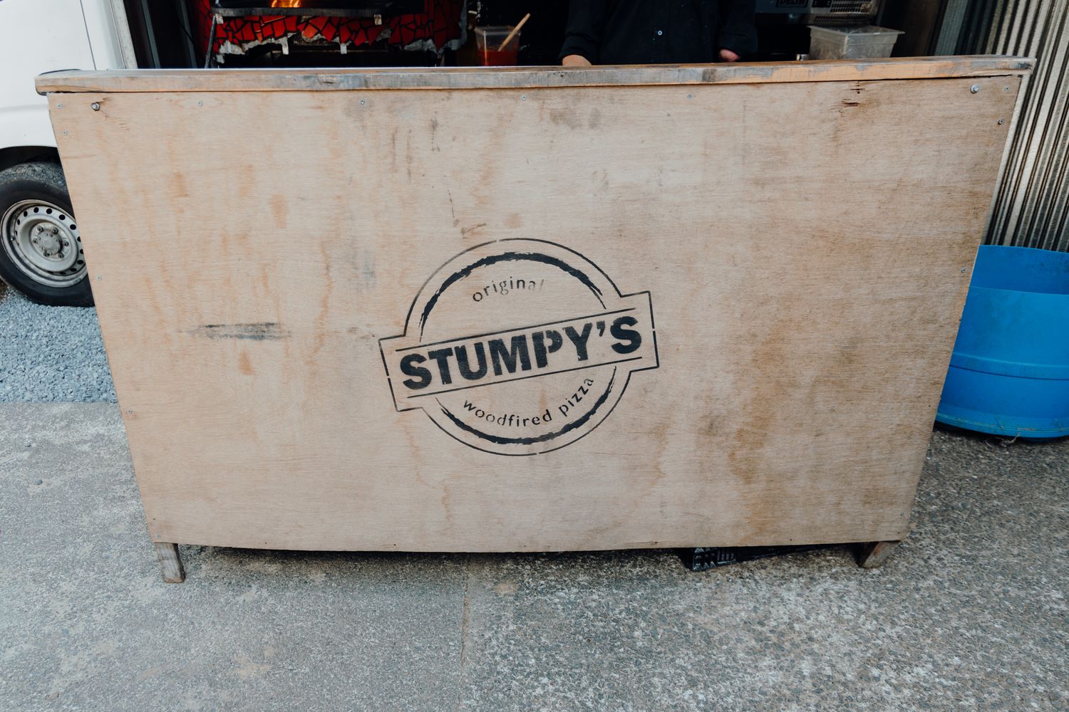 Wooden storage box with Stumpy's logo branding on the side.
