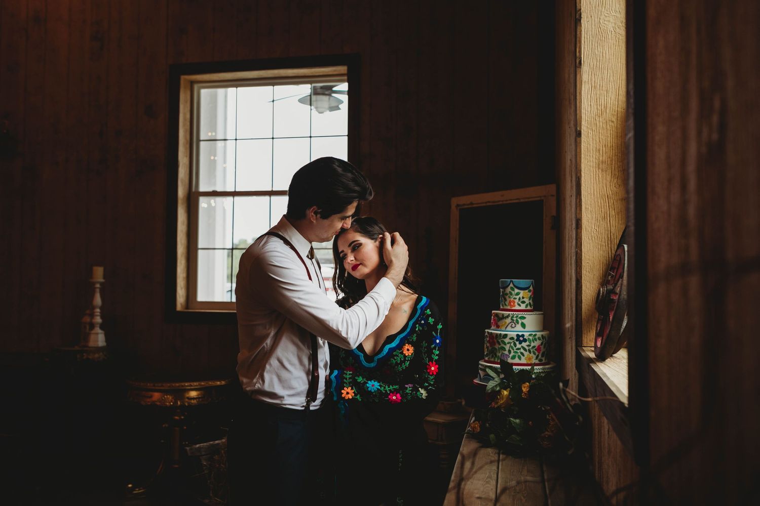 wedding couple, intimate pose, wedding cake, window light