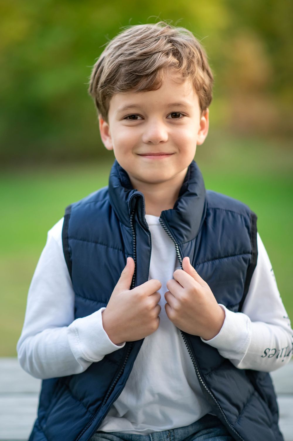 Little boy gets ready for fall with his vest in butler Pennsylvania