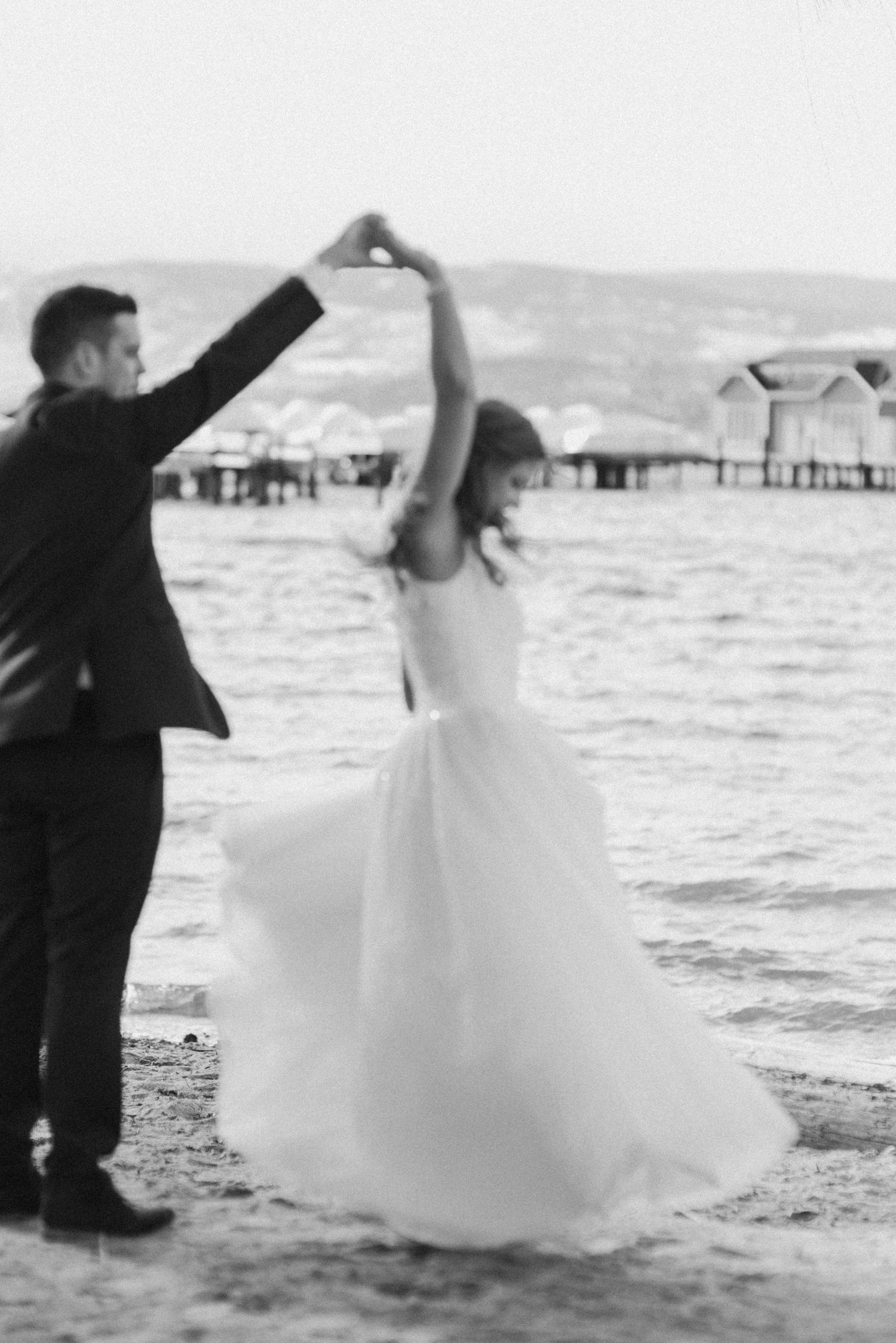 bride-and-groom-dancing-on-a-beach