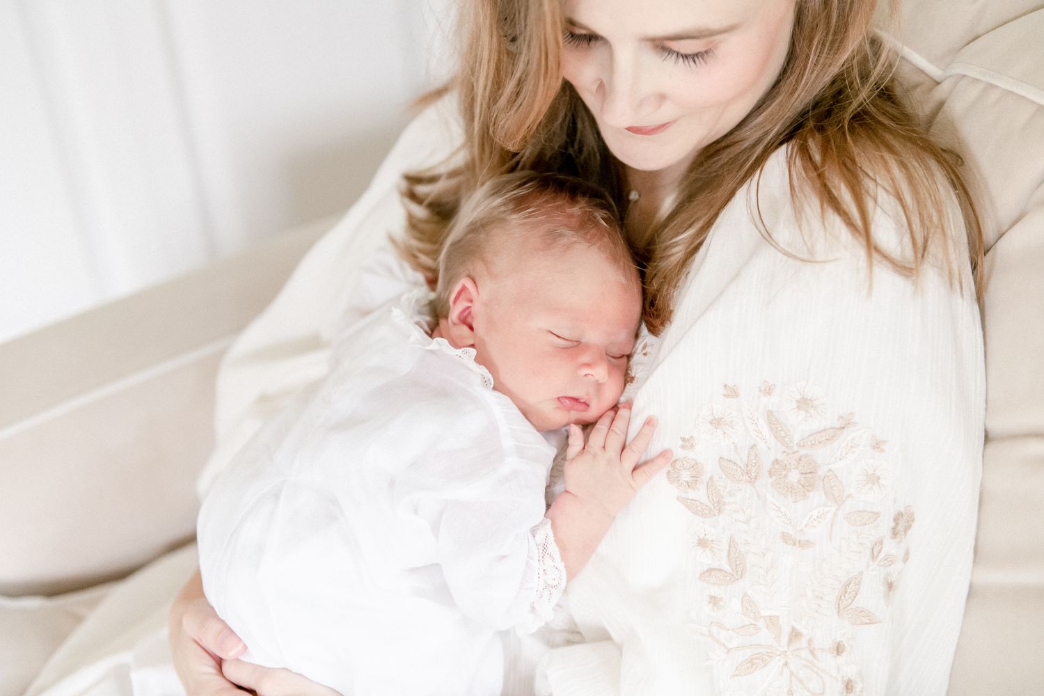 New mother snuggles her baby