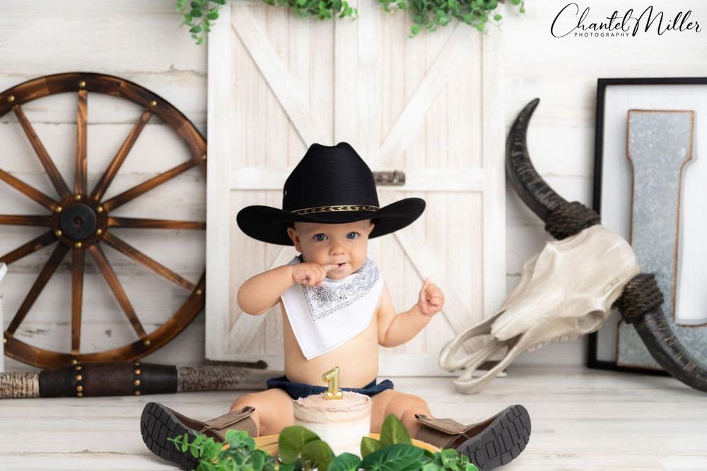 baby cowboy eating cake