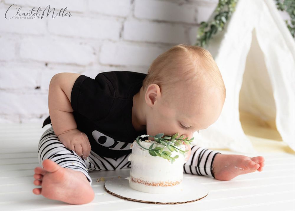 baby boy bending over eating cake