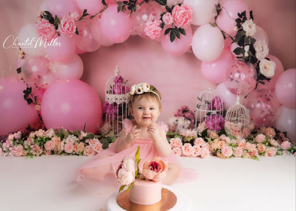 baby girl eating cake pink floral cake smash