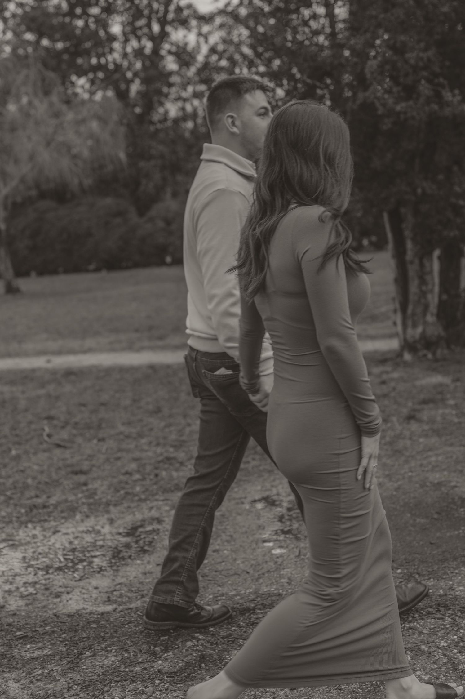 A couple in formal attire poses together outdoors during a romantic photoshoot. photo by Samantha Campbell imagery