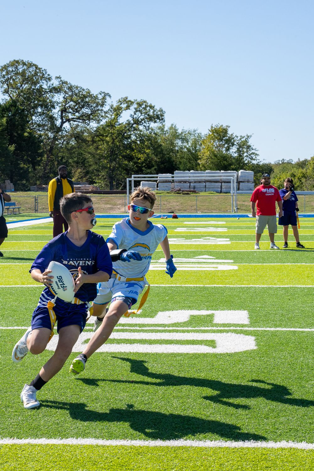 Boys playing NFL flag football