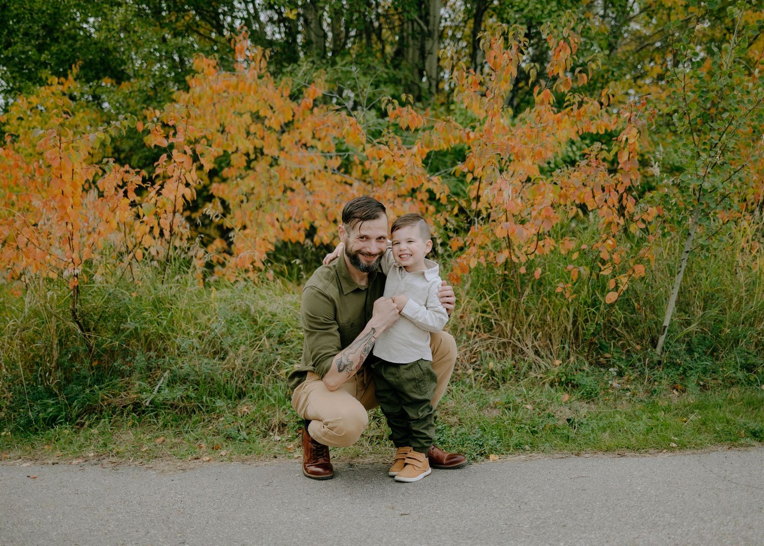 Fall foliage creates colorful backdrop for outdoor portrait.
