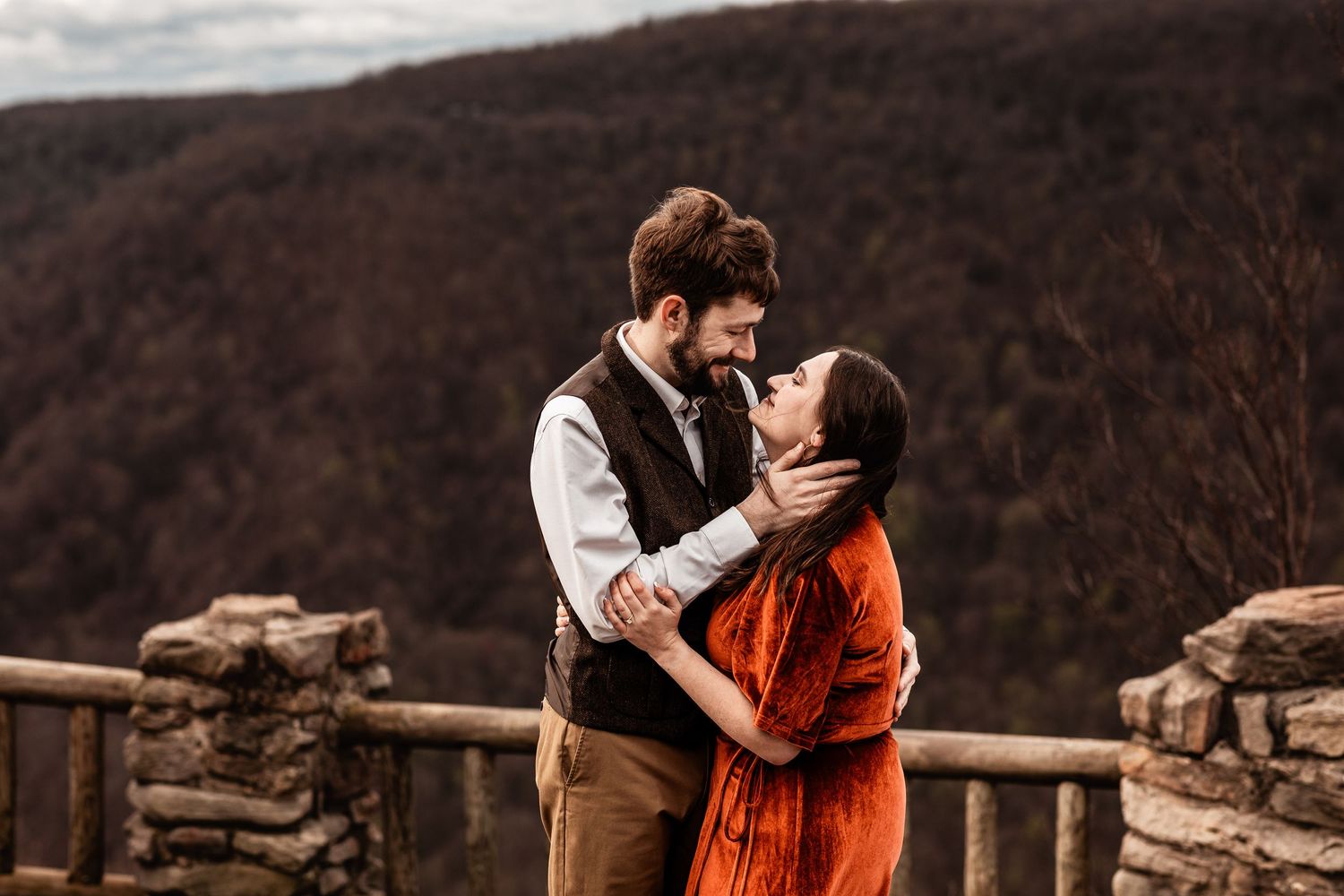 WV engaged couple embrace at Coopers Rock State Park