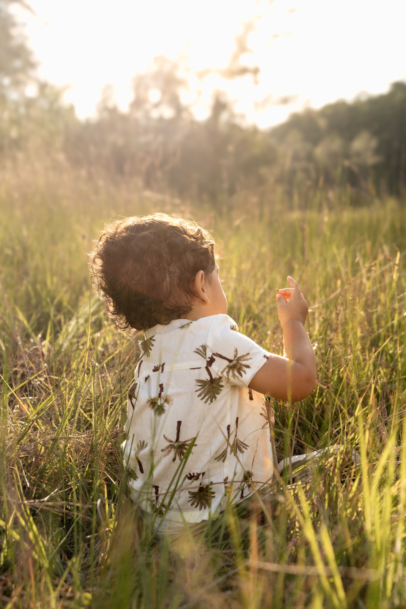 Candid toddler in meadow aesthetic