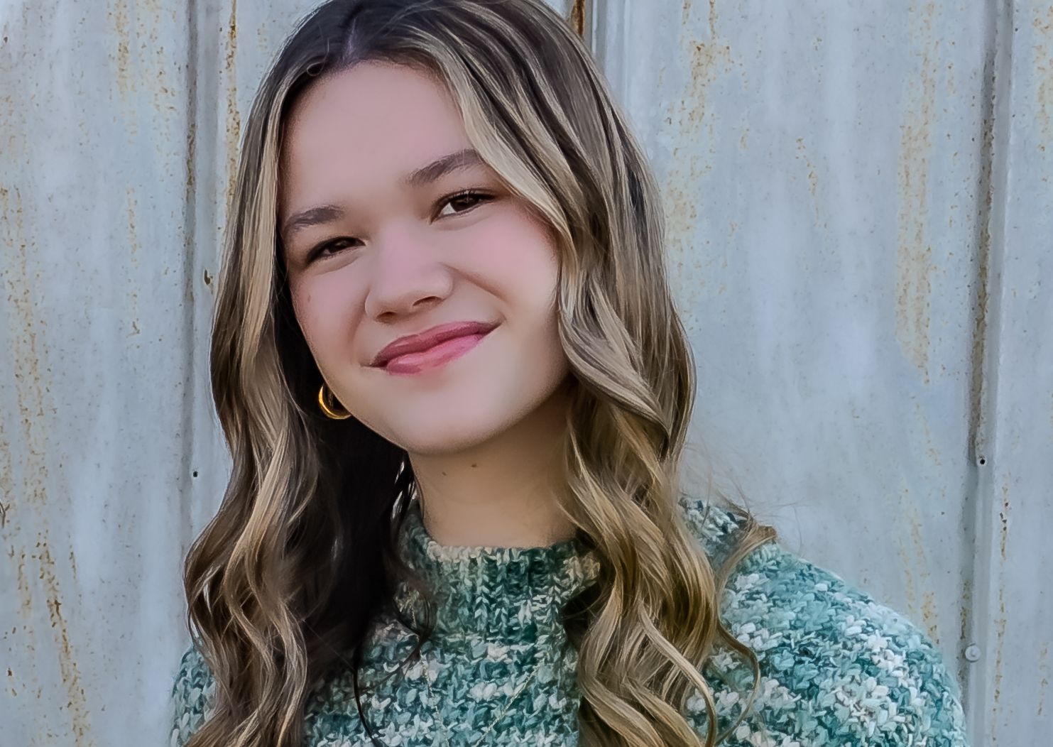 Portrait series showing someone with wavy brown hair wearing a green sparkly top against a light background.