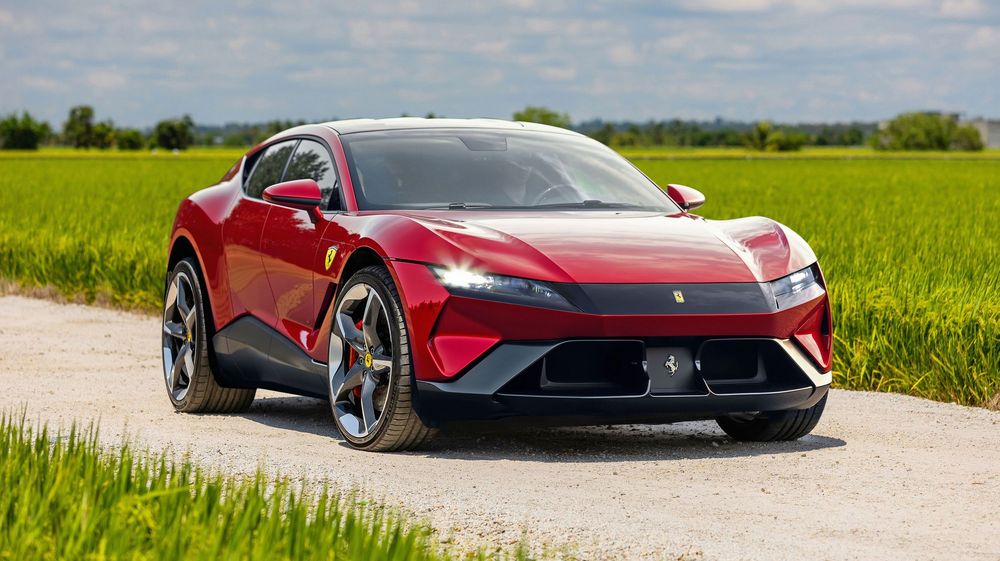 Ferrari Purosangue red luxury SUV parked on dirt road with green field in background on sunny day.