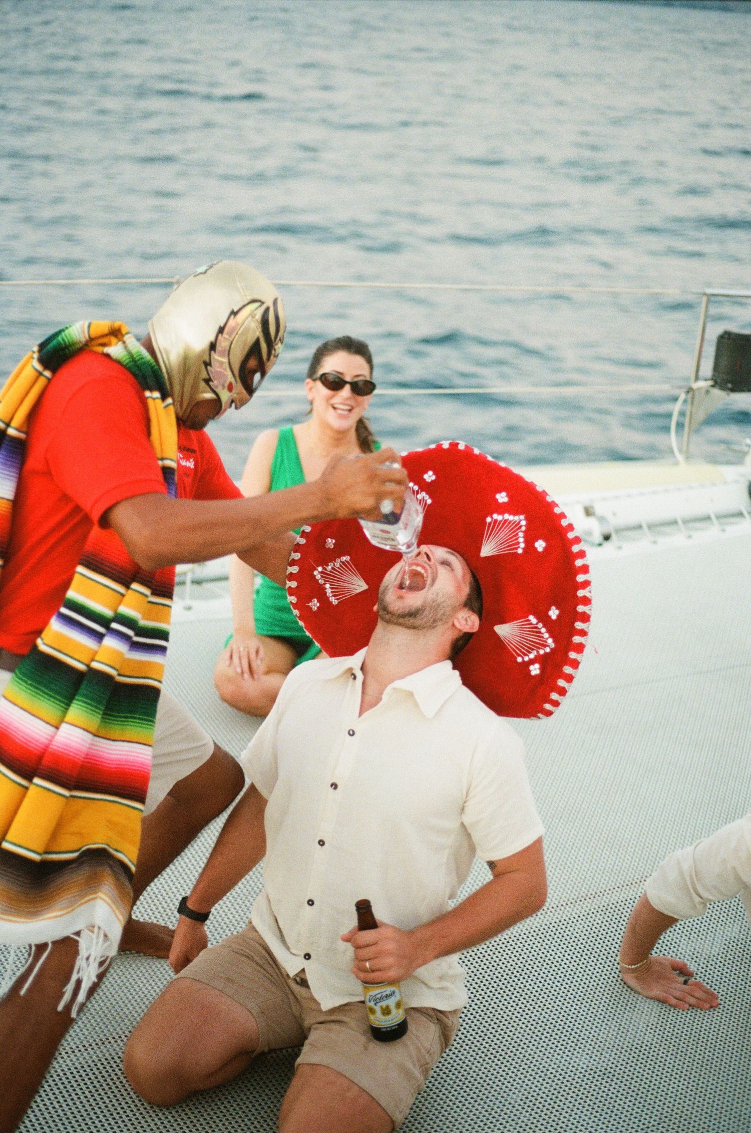 Celebratory moment on a boat deck with festive Mexican-themed accessories.